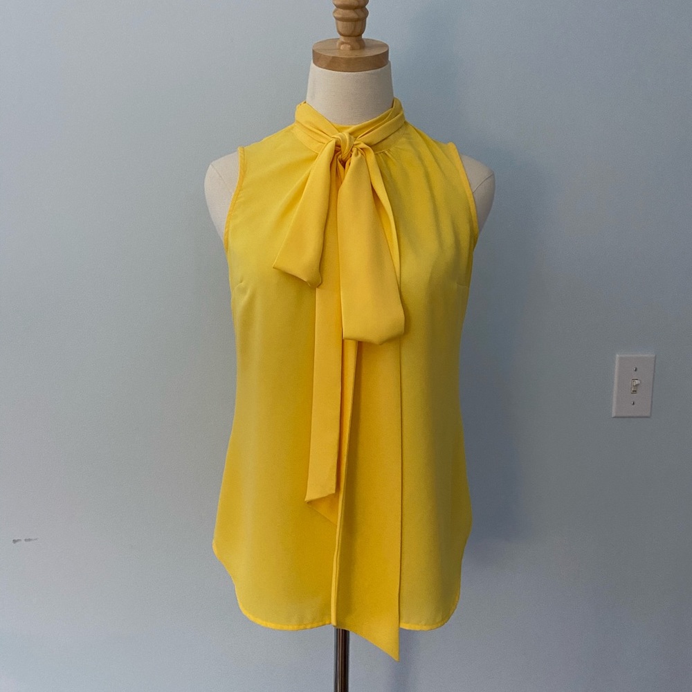 Yellow sleeveless blouse
